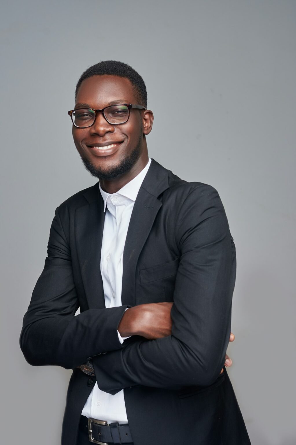 Founder in a dark suit and glasses