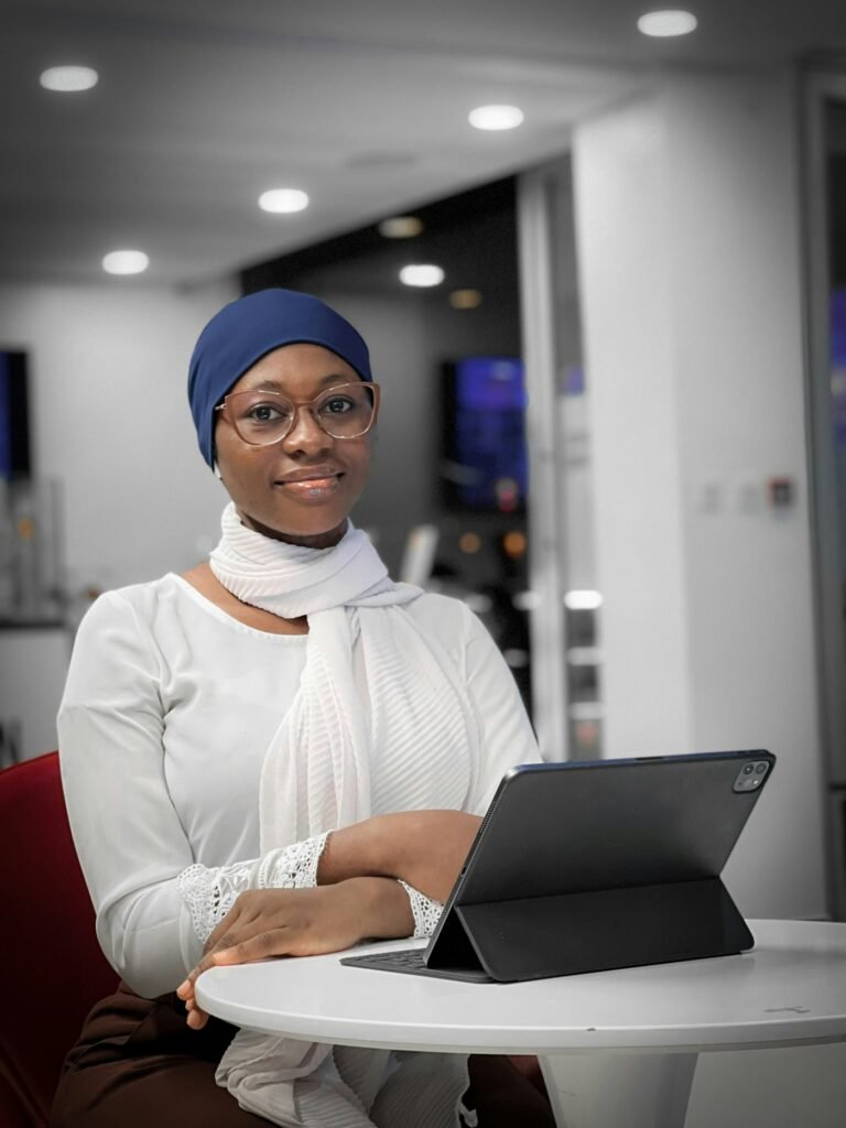 Entrepreneur in a headscarf working in a bright office